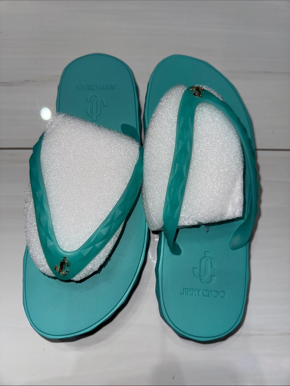 Jimmy Choo Women’s Turquoise Flip-Flop Sandals with Gold Logo